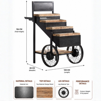 Industrial cart inspired display shelf made of iron with mango wood tiers and spoked wheels, measuring 108 cm long, 69 cm wide and 124 cm high.