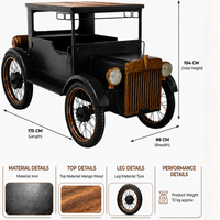 Vintage black car inspired bar counter made of iron with mango wood top and tyre wheels, measuring 175 cm long, 86 cm wide and 104 cm high.