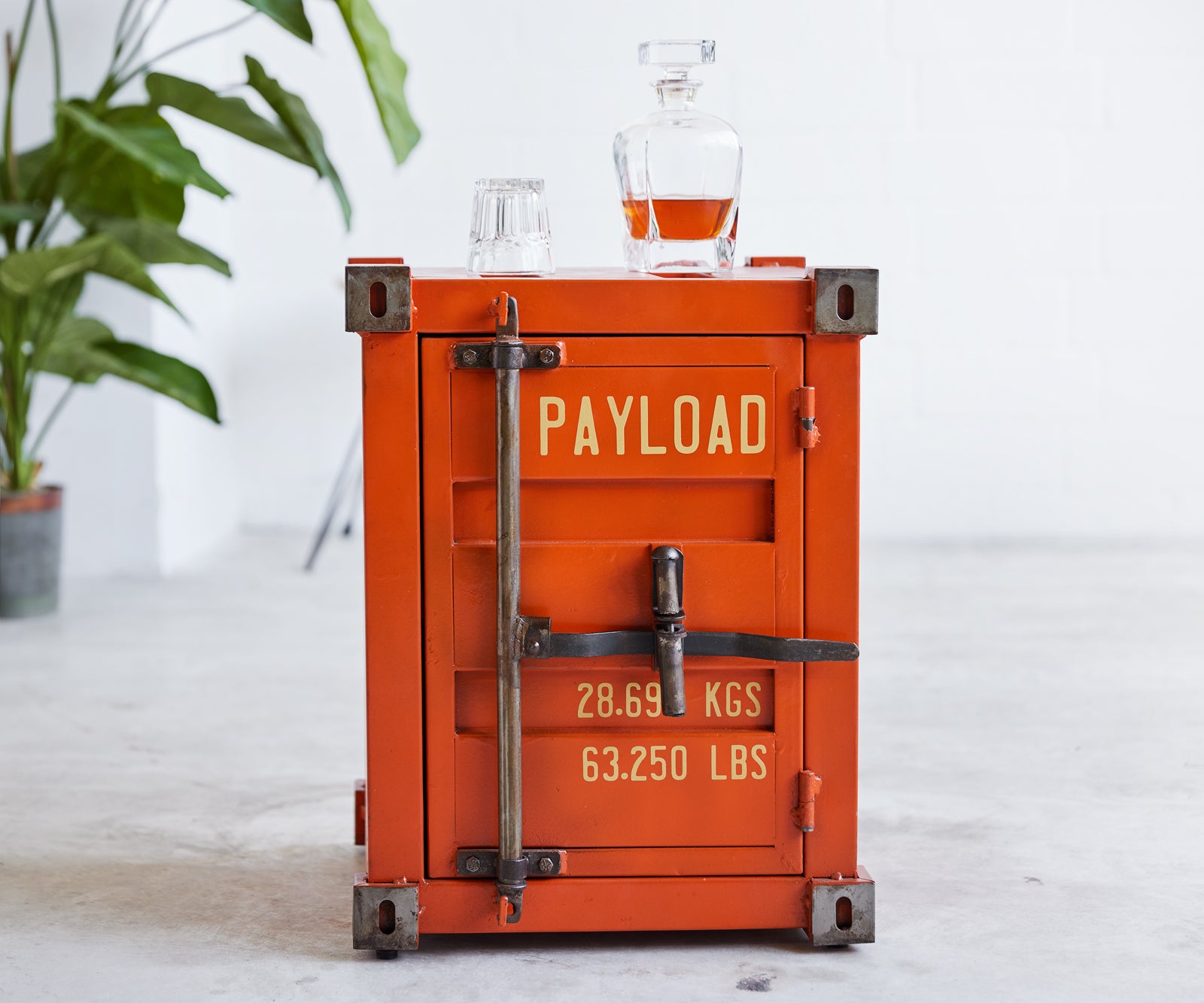 Orange cargo container repurposed as a side table 