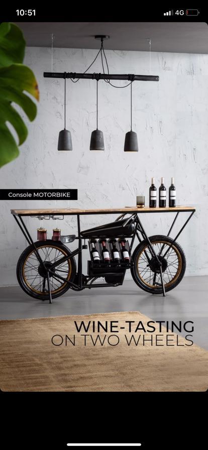 Retro motorcycle bar console with wooden top and storage.