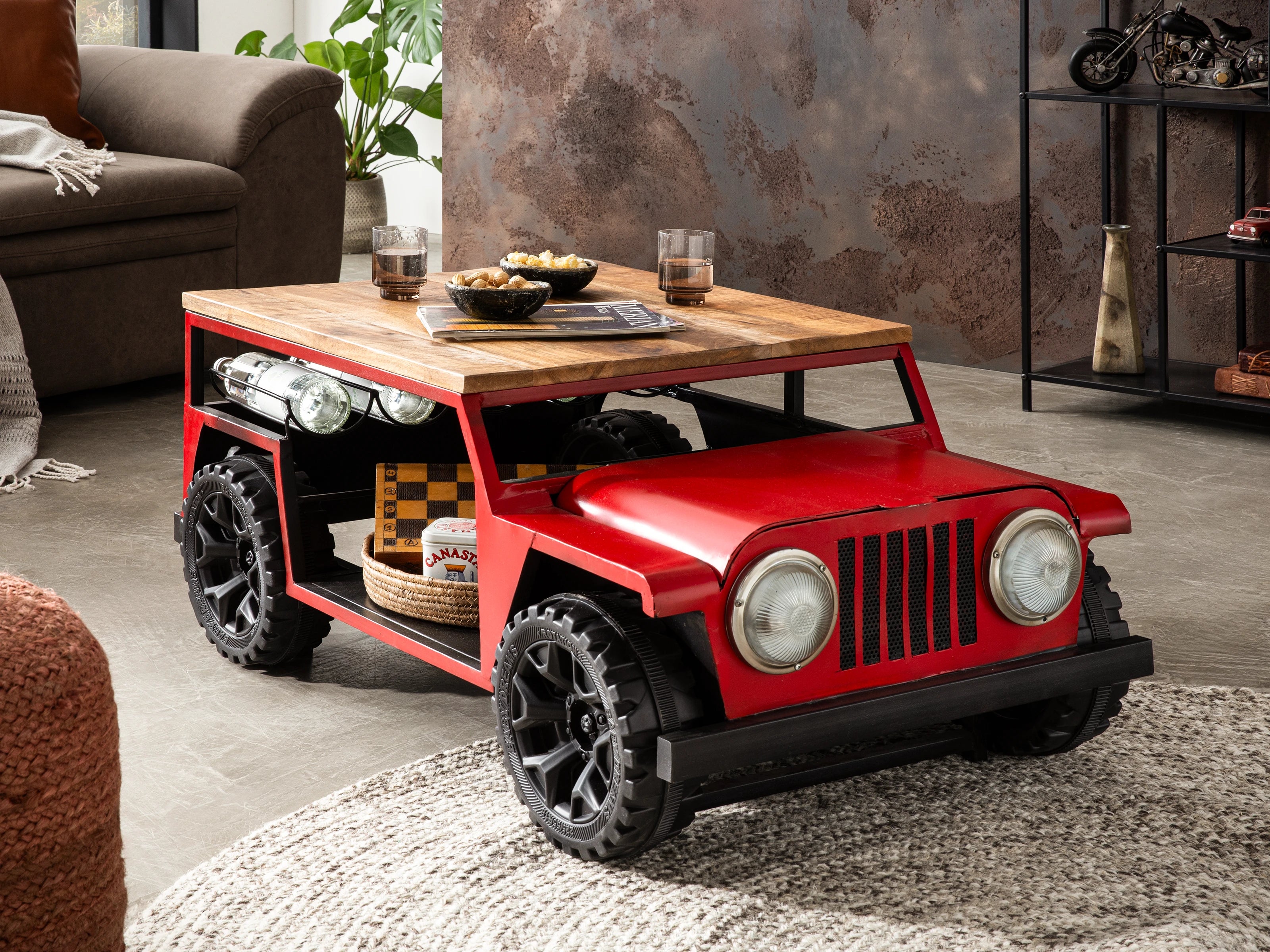 Coffee table shaped like a red jeep with a wooden top.