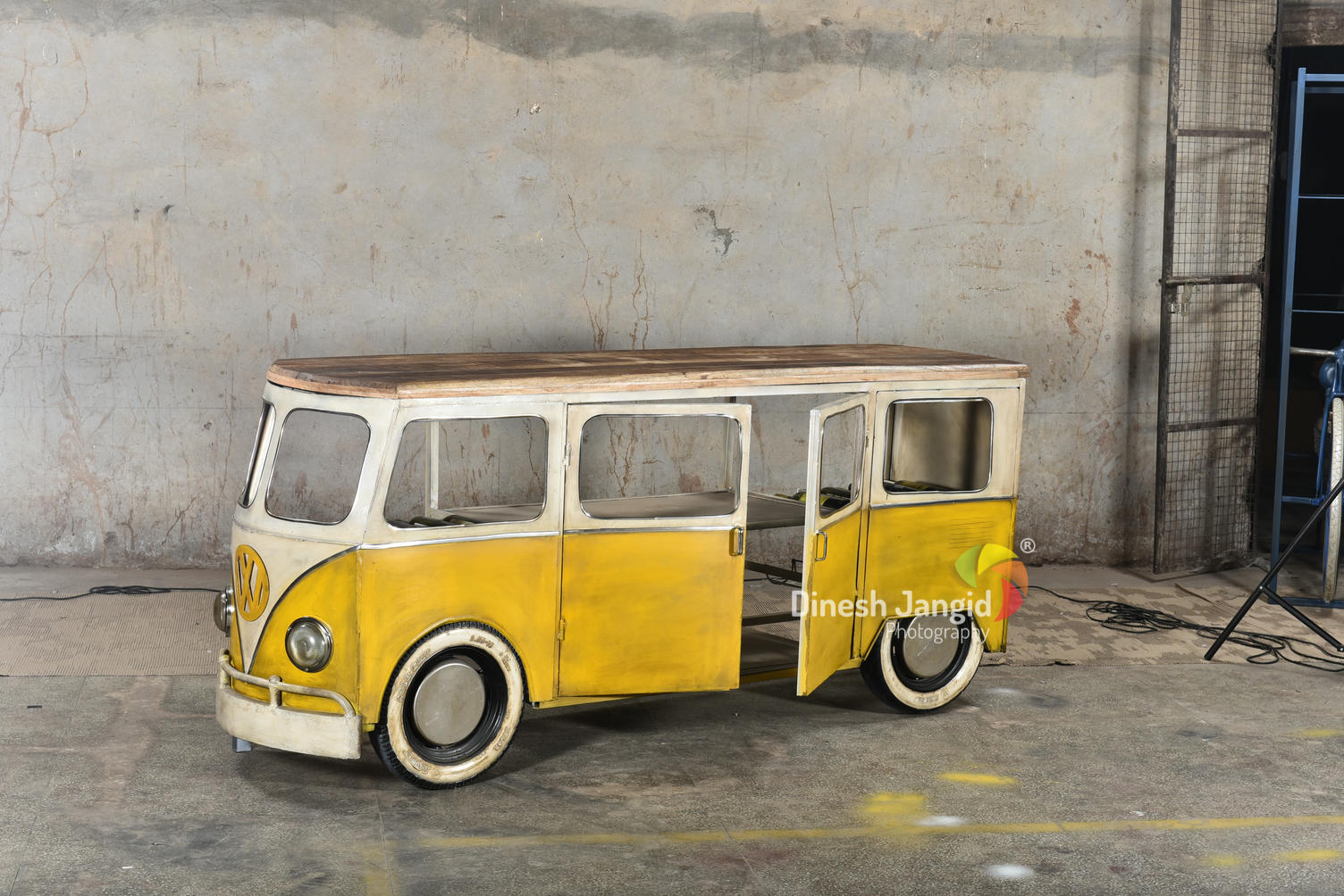 
Vintage-style yellow van bar with glass storage