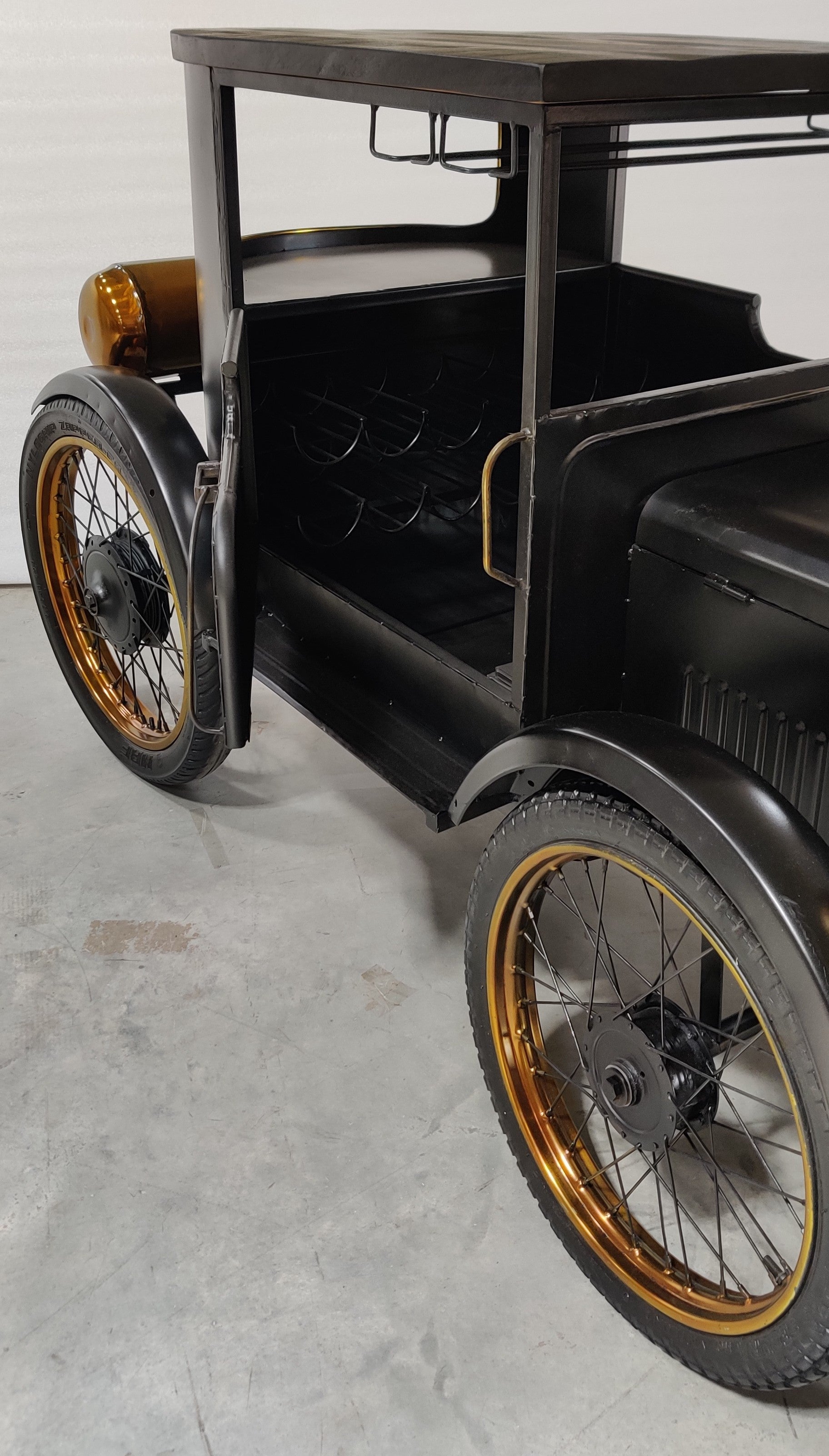 Black and gold car-shaped bar counter with a classic design