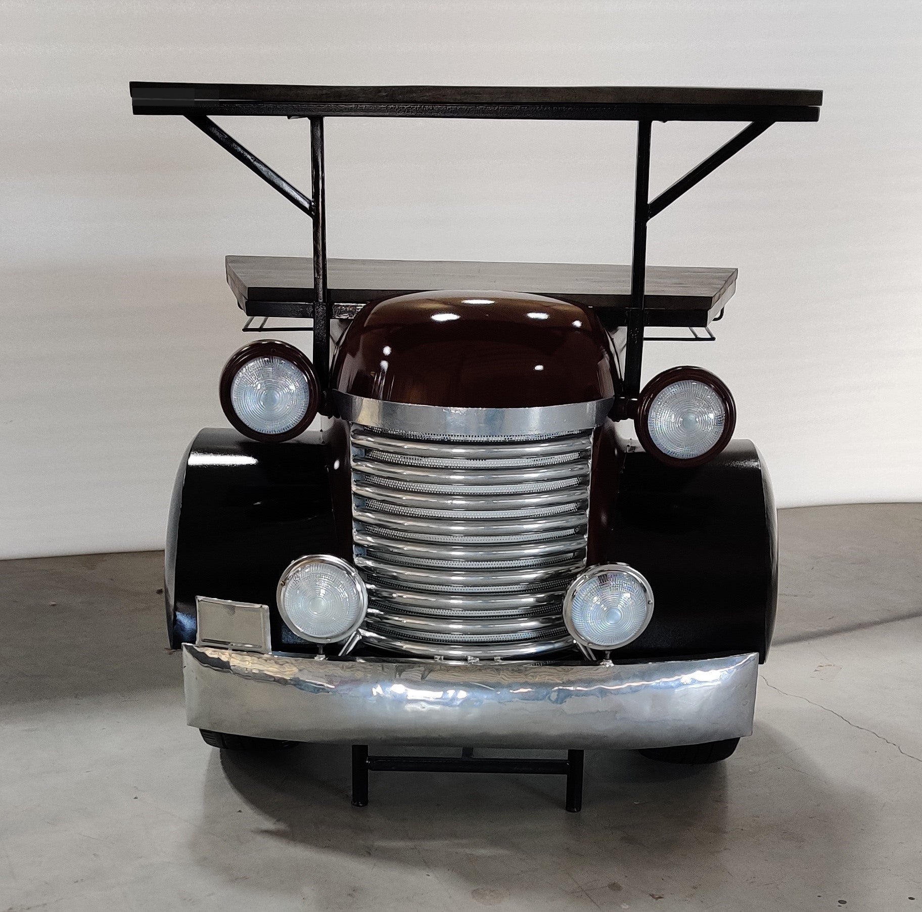 Bar counter designed like a vintage truck front with chrome details