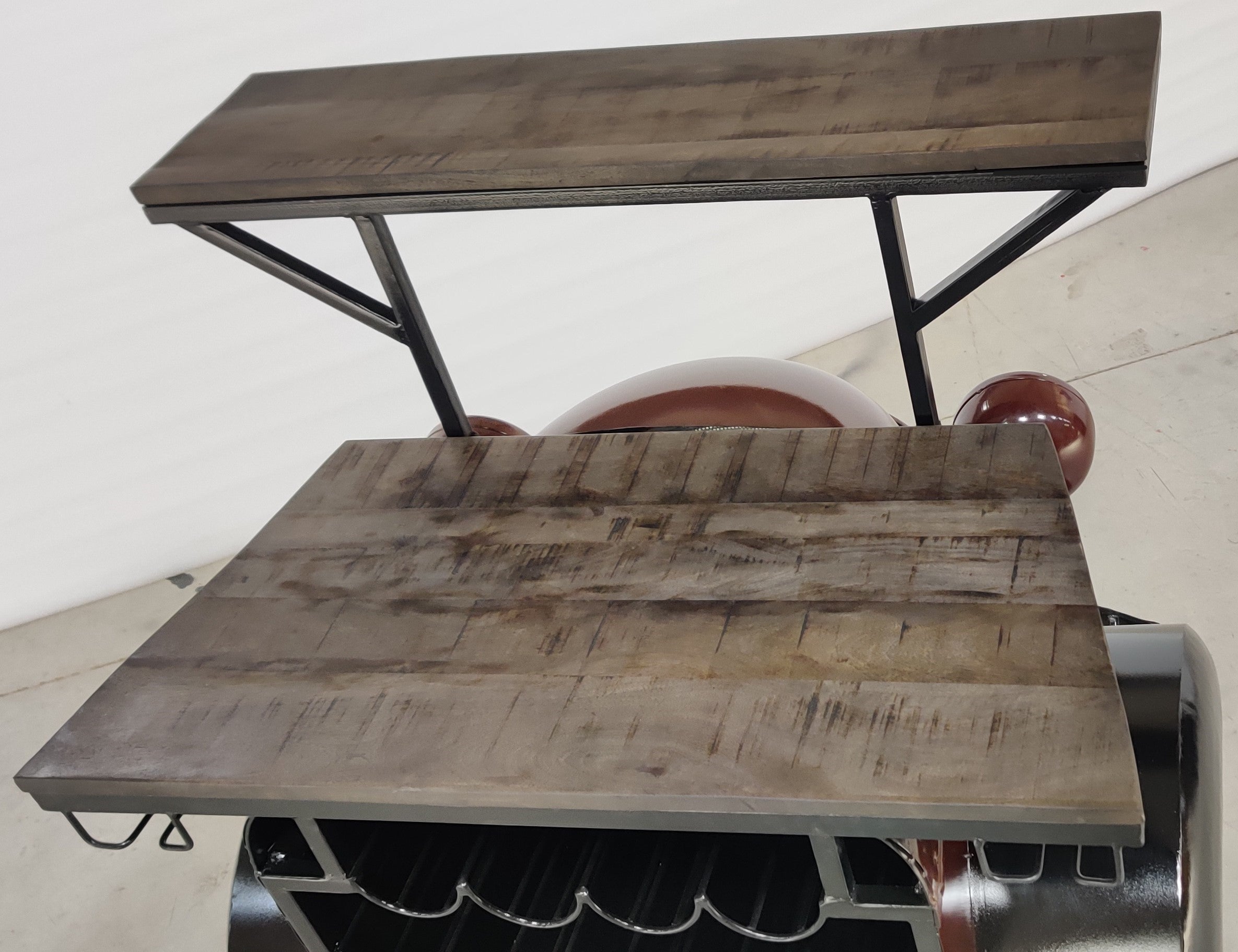 Retro truck-shaped bar counter with a metal finish and wooden surface
