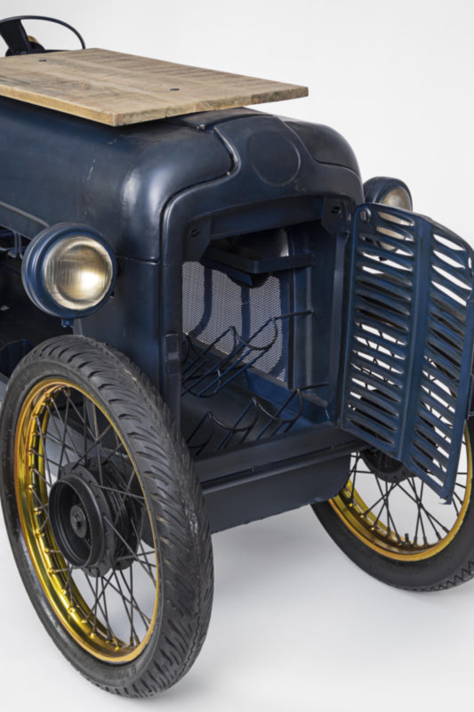 Vintage-style vehicle converted into a table with wooden top