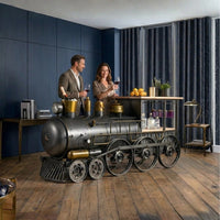 Railway engine themed bar counter with vintage industrial design, storage shelves and metal finish by Foxfurn
