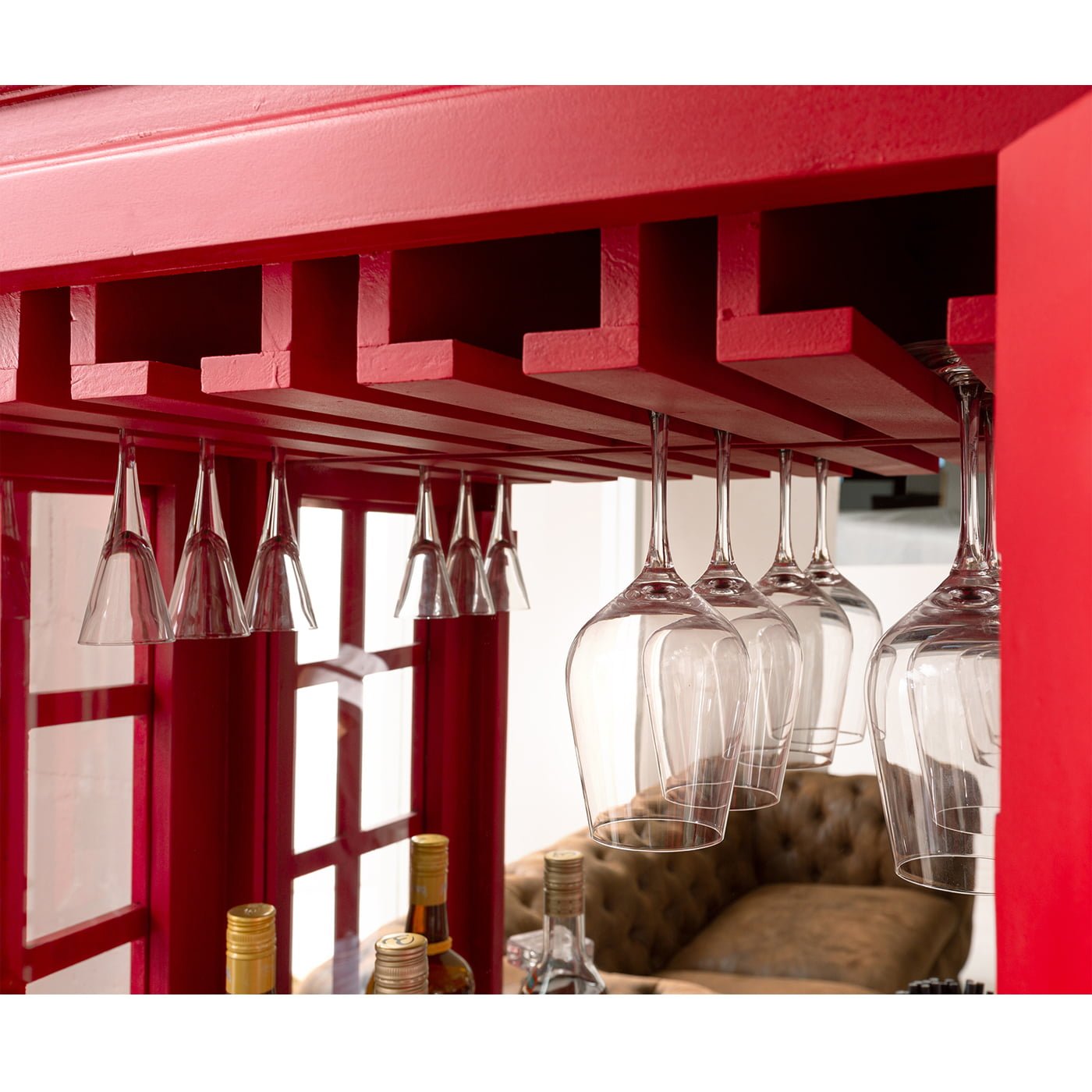 Vintage telephone booth bar cabinet with wooden finish and storage shelves for home bar setup by Foxfurn