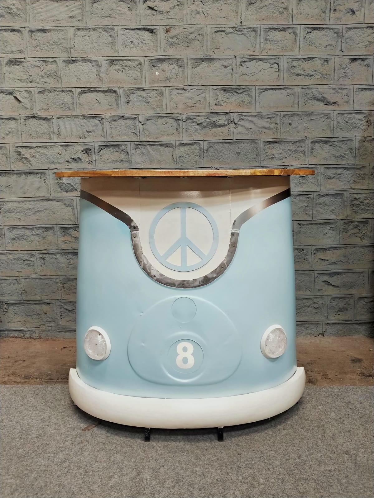 Retro counter with a vintage car design and wooden tabletop.