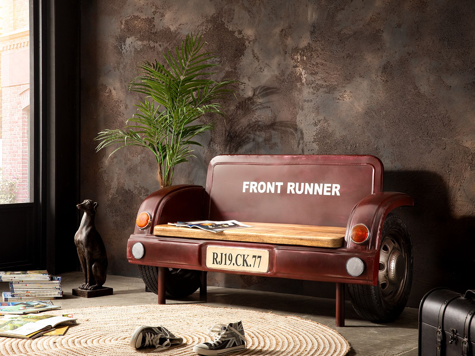 Sofa designed like a vintage car with wooden seat and wheels