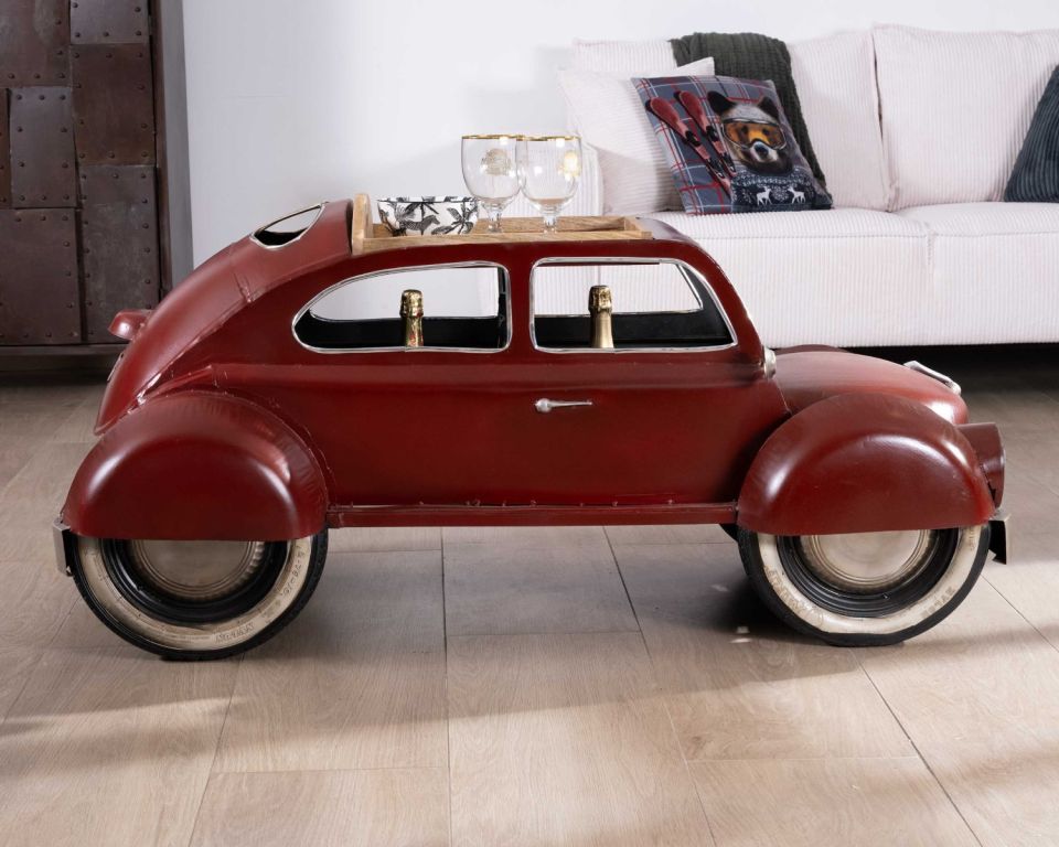 Red car coffee table with a wooden surface and storage space.