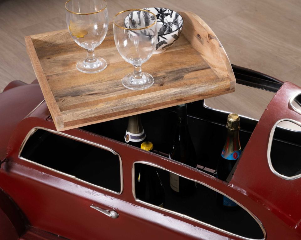 Retro car-inspired table with a wooden top and storage.
